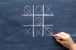 hand-drawing-a-game-of-tic-tac-toe-with-colored-crayons.jpg